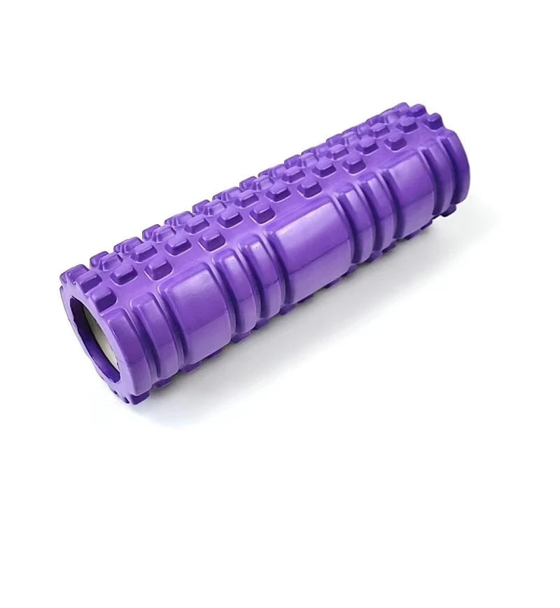 Purple foam roller with textured surface on a white background